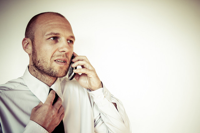 businessman-phone-tight-tie