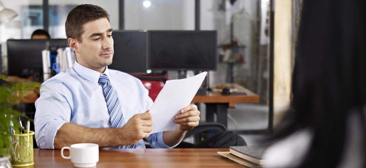 HR recruiter utilizing his recruitment skills while interviewing a candidate.