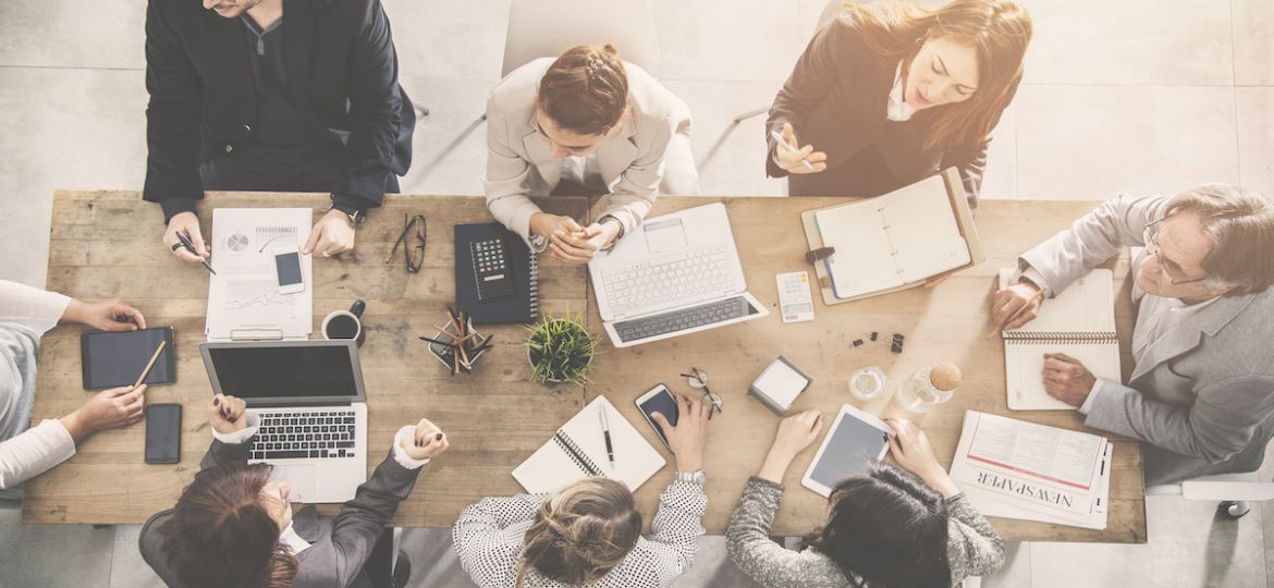 Group of diverse business people strategizing about their hiring efforts