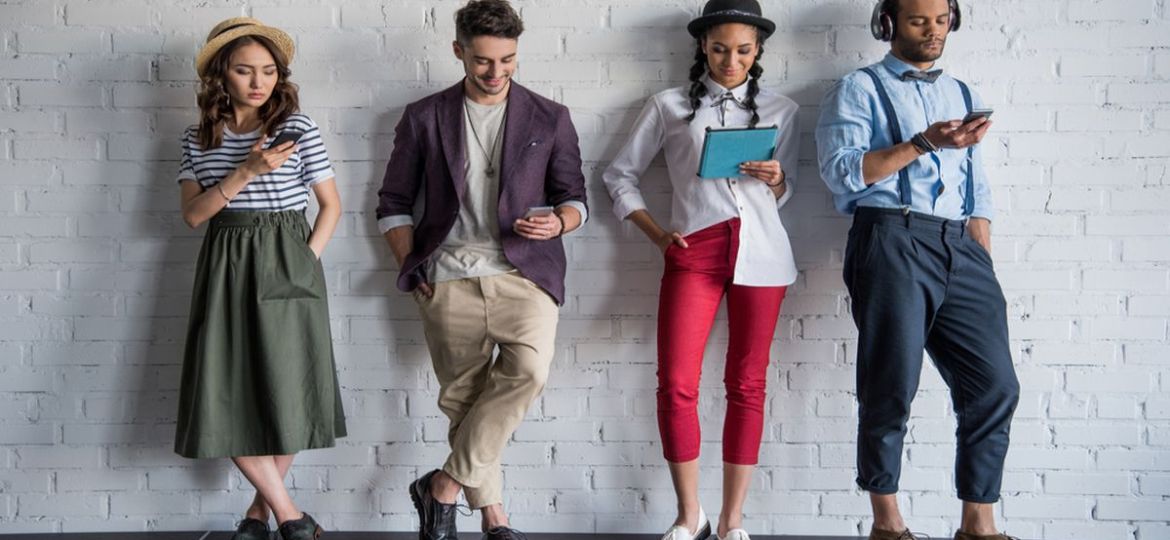 Millennial job seekers standing against a wall