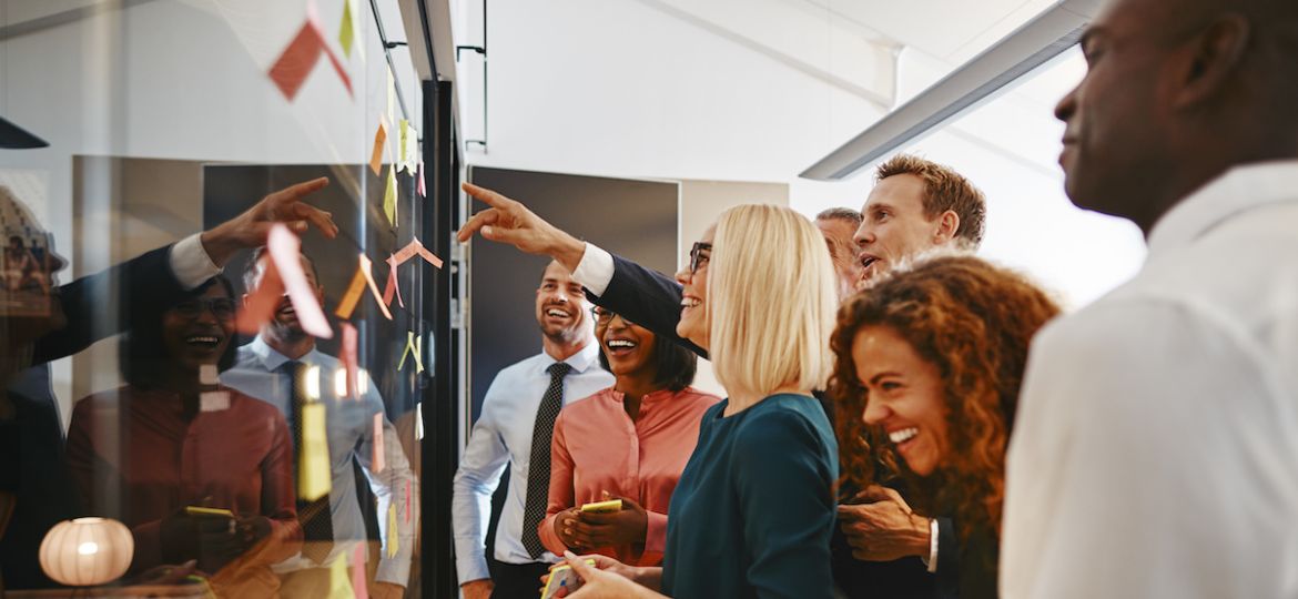 Group of cognitively diverse businesspeople brainstorming together in the office.