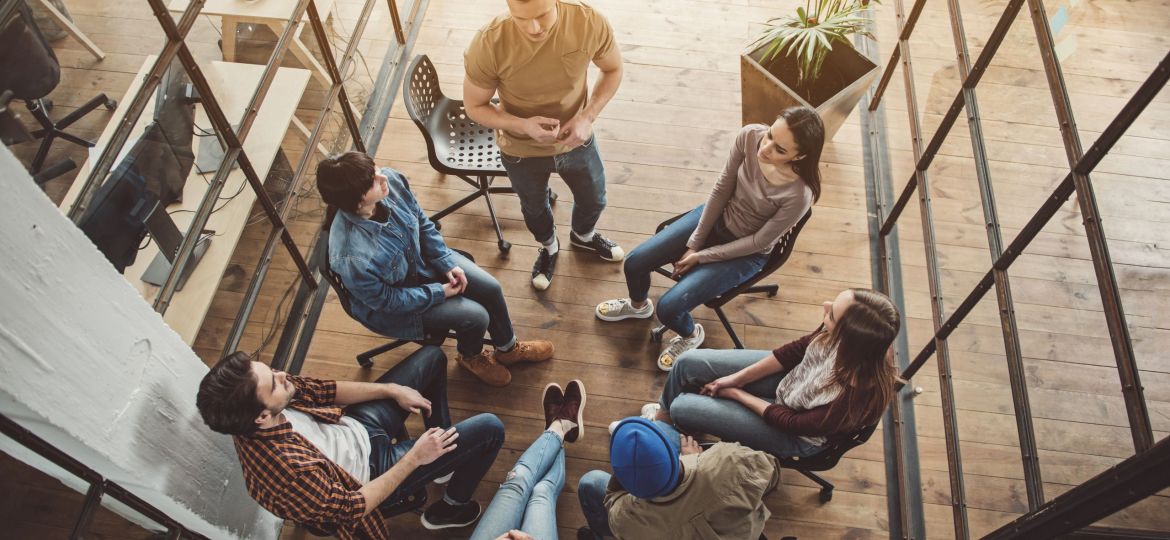 group of people sitting doing 5 minute team building activities