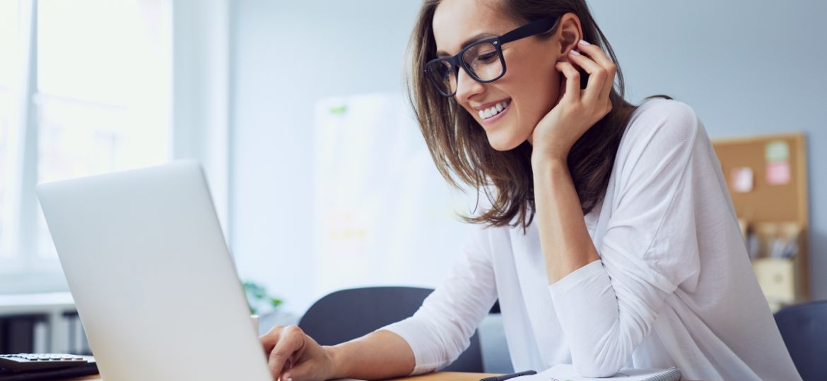 Woman at computer learning 8 Social Recruiting Strategies That Always Work