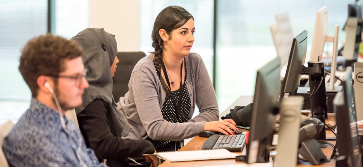 woman at desk thinking about employee retention strategies