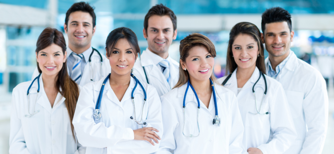 Group of healthcare professionals in workplace, overcoming top HR challenges in healthcare.