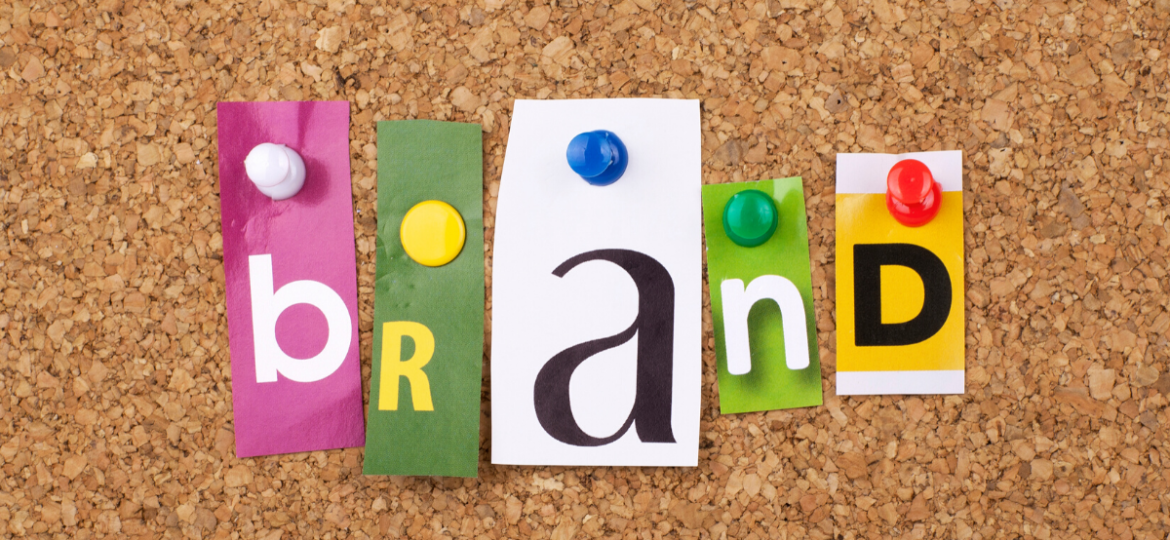 brand spelled out in cut out letters on a cork board, during the corporate brand vs employer brand debate.