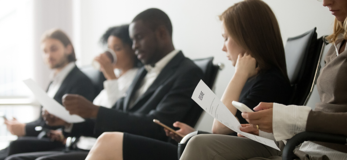 An office filled with a group of high value job seekers waiting to be interviewed, after finding a company based on their candidate attraction strategies.