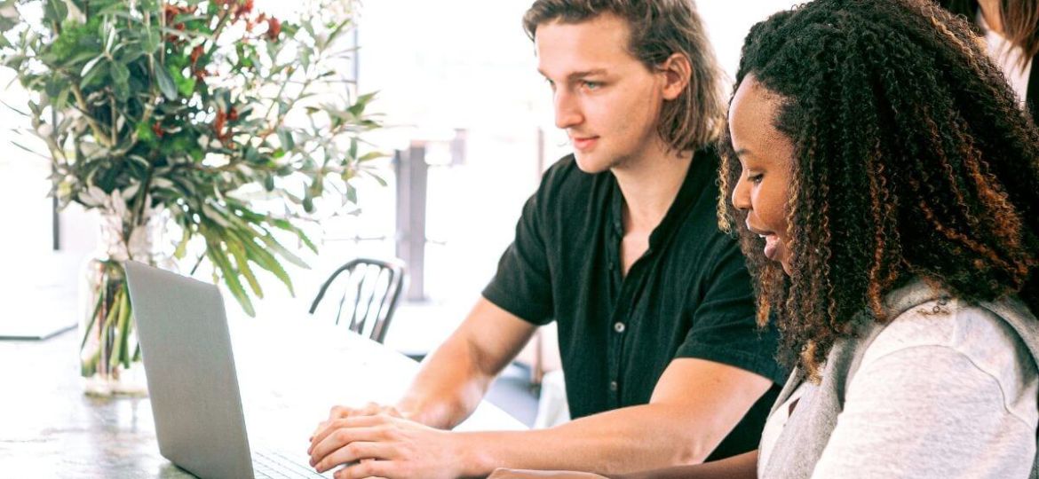 Man and woman looking at laptop